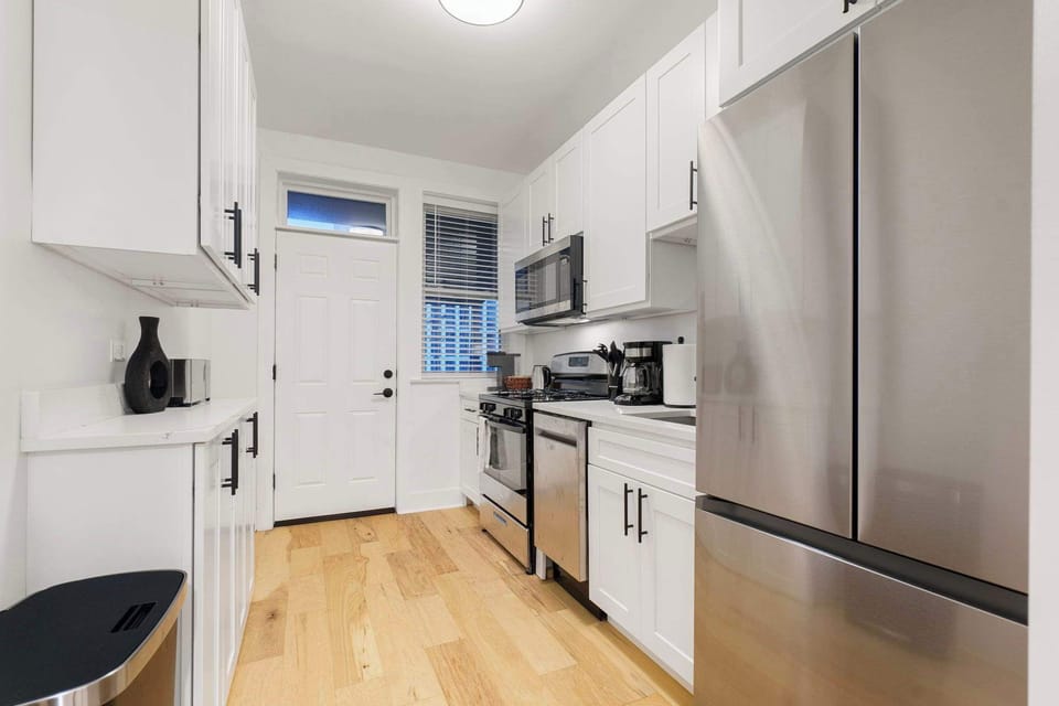 Bright kitchen view w/ clean lines & functional layout.