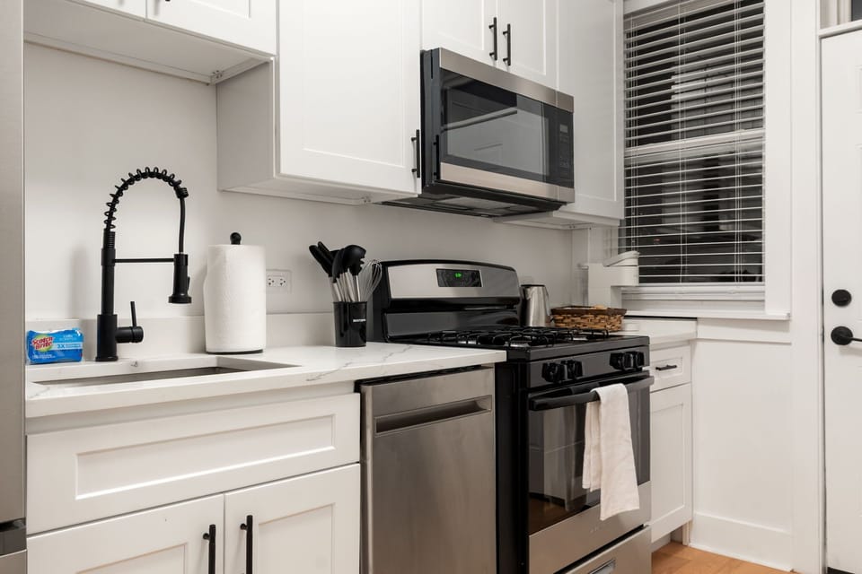 Sleek kitchen w/ modern appliances & plenty of counter space for cooking.