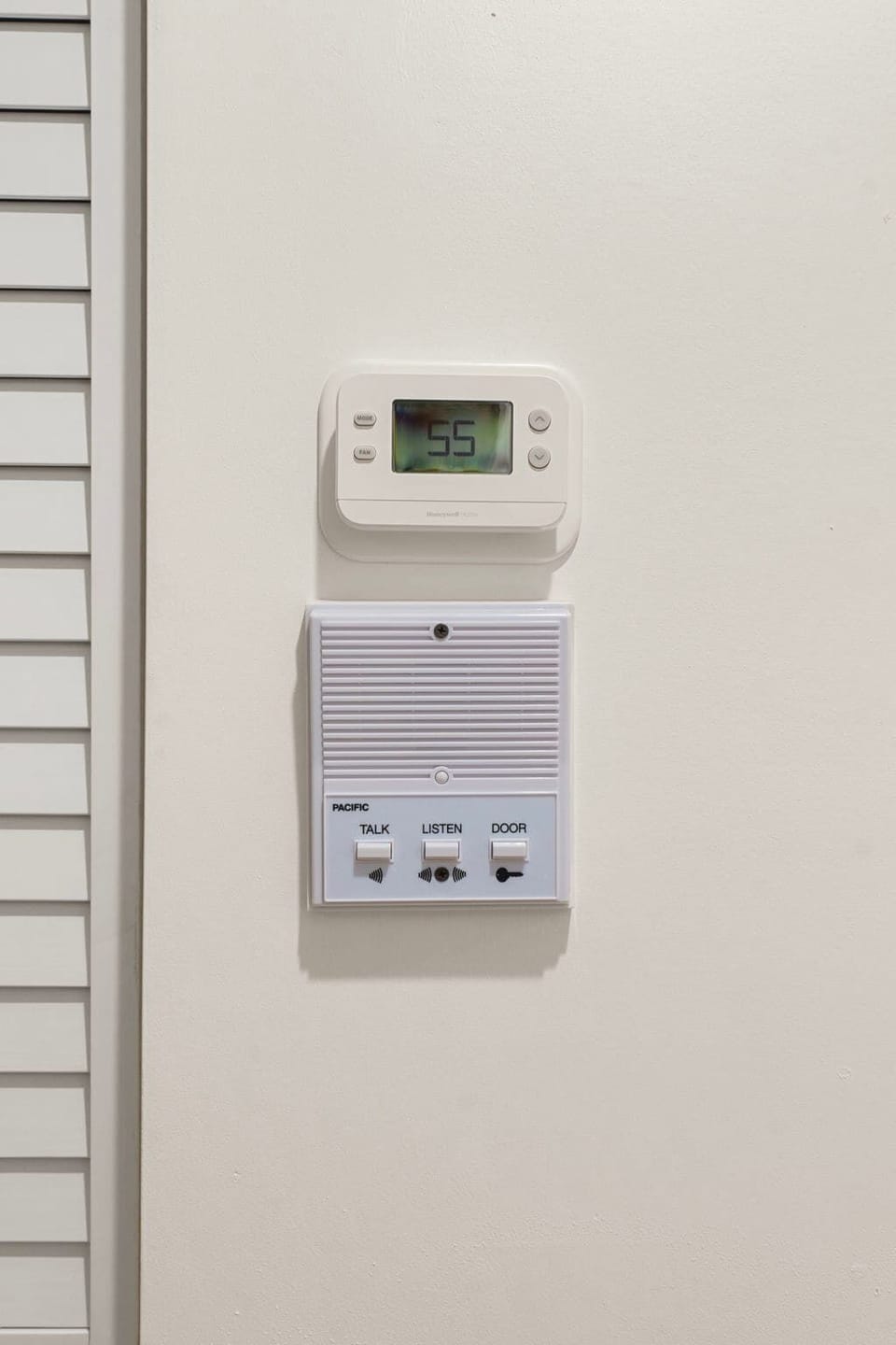 Minimal wall-mounted control panel placed for easy access.