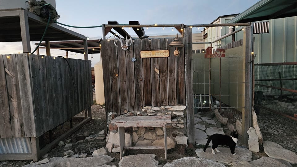 Entrance to outdoor privy and shower