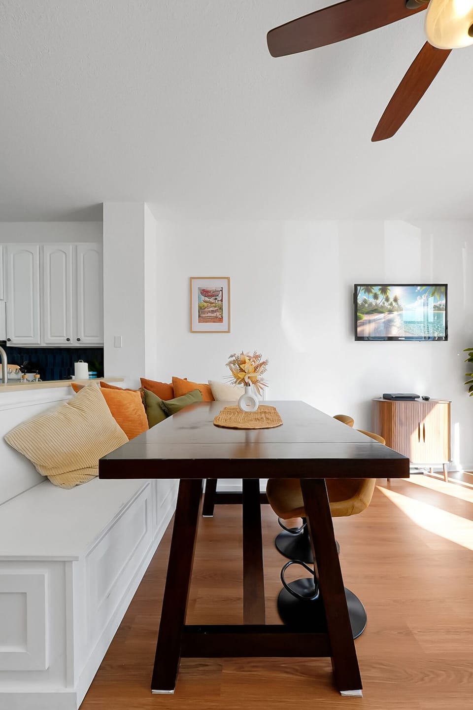 Gather around the cozy dining nook for a quick breakfast or game night 