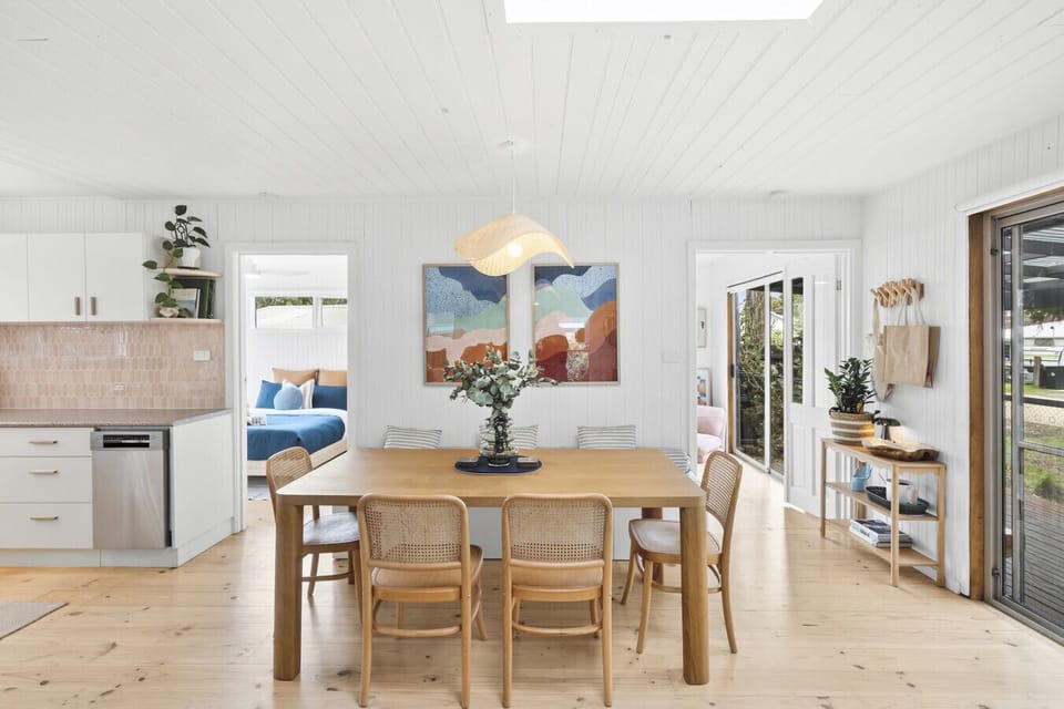 Open-plan dining and kitchen area with indoor-outdoor flow