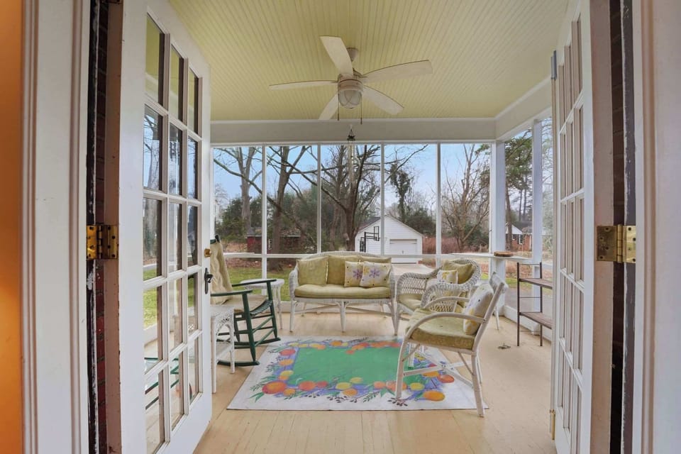 This inviting porch offers a charming spot to relax and take in the surroundings.