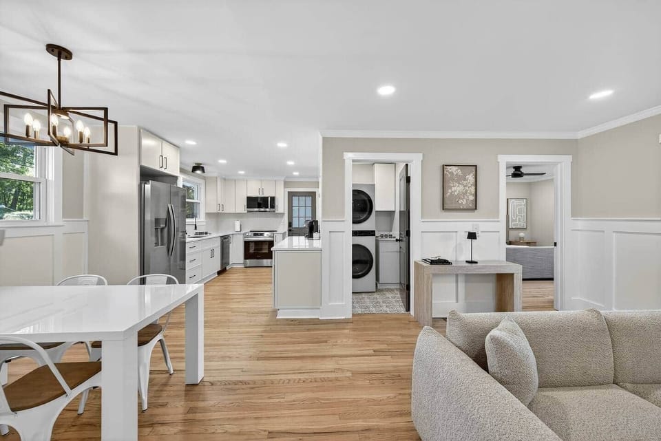Bright, open layout connecting kitchen, dining, and living spaces