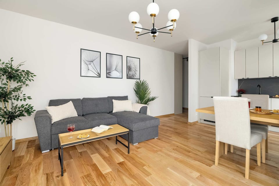 Elegant living room with framed artwork and a comfortable seating area.