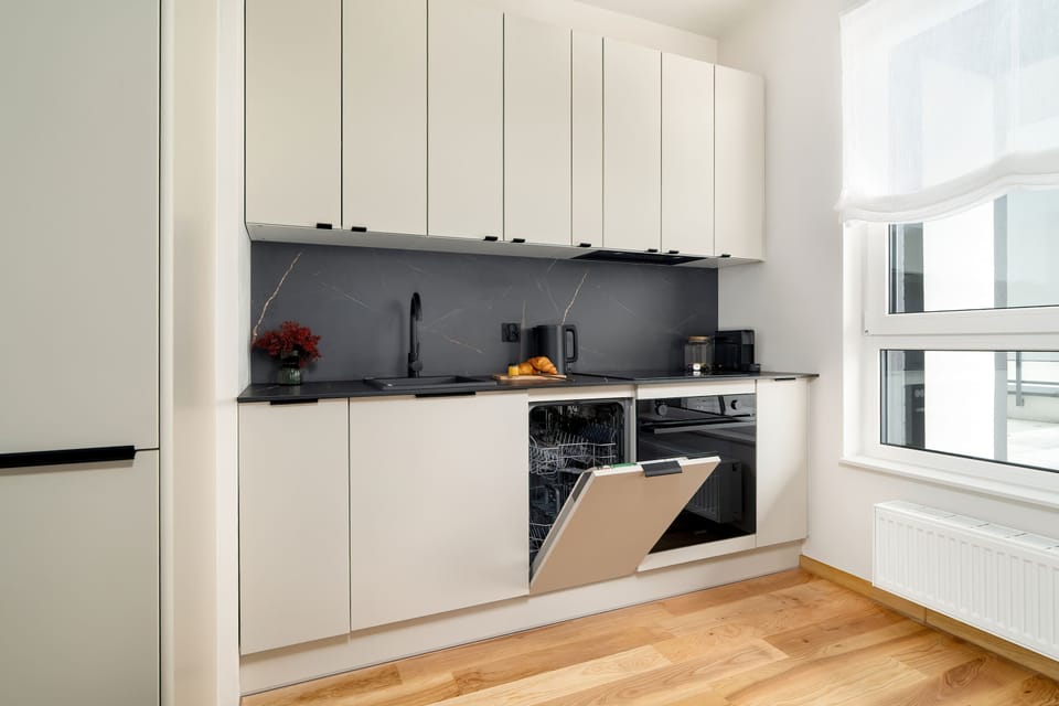 Bright kitchen with oven, induction stove and plenty of counter space.