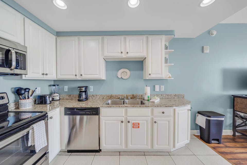The fully equipped kitchen features granite countertops, stainless-steel appliances, and has everything you need to prepare meals for family and friends.