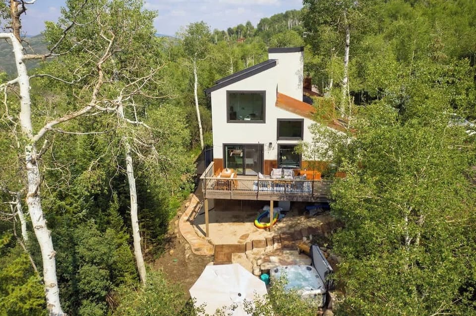 Amenities like the hot tub, outdoor living area, and proximity to the mountain make this a great vacation home! 