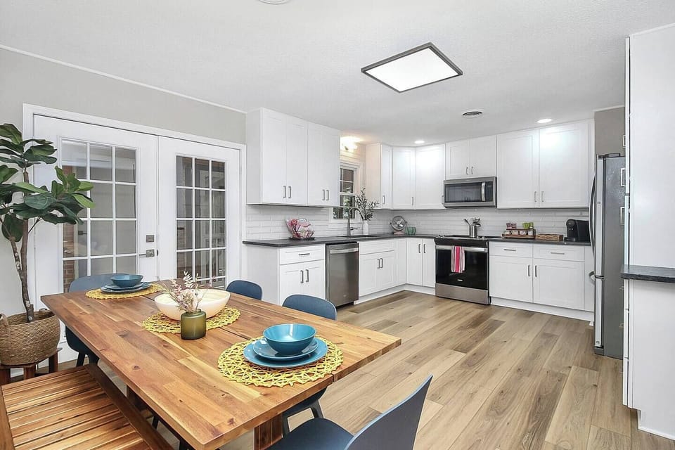Meal prep's a breeze in this fully remodeled kitchen featuring granite countertops, upgraded appliances (large and small), a well-stocked coffee/tea station with thoughtful extras. Fresh, filtered water spout inside refrigerator for your convenience.