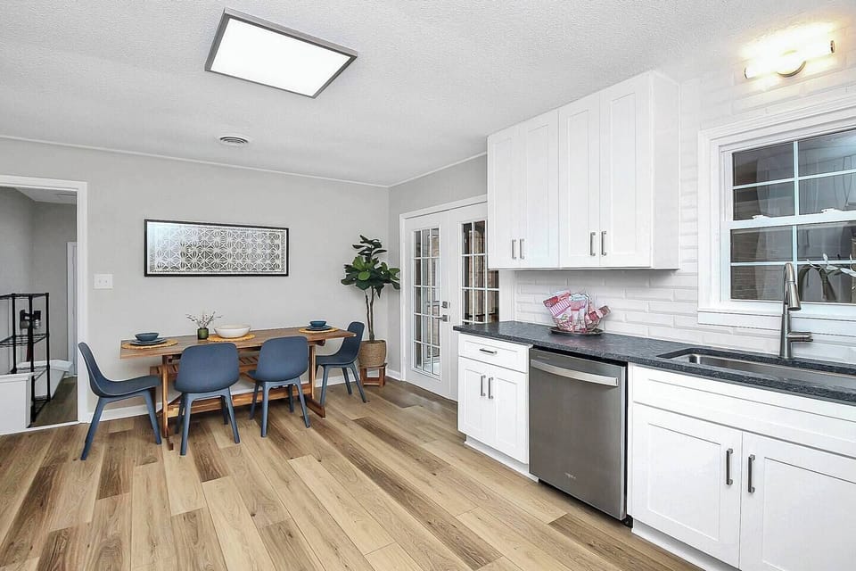 Eat-in kitchen with space for 6 easily, access to laundry room (additional refrigerator) and patio.
