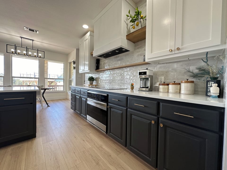 Spacious kitcehn with coffee maker, oven and plenty of counter space, cabinetry