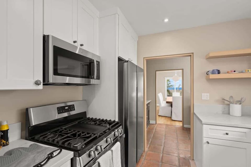 Kitchen View: A new Gas stove with stainless steel microwave and Fridge accessories for any Vacation Cooking! 