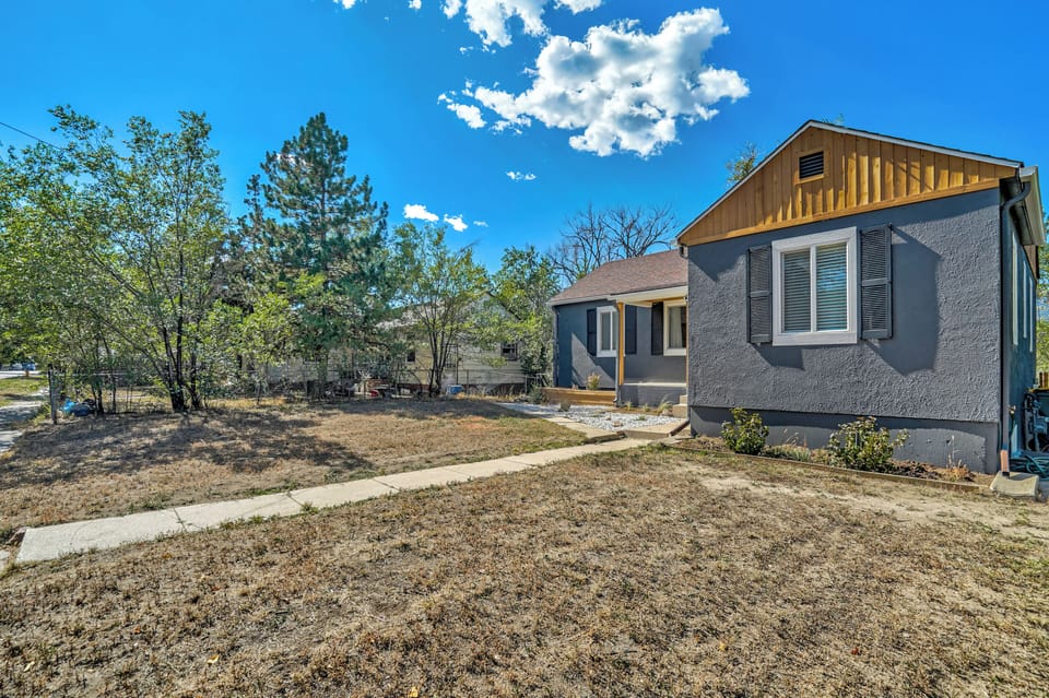 Step into your charming retreat where modern comfort meets rustic charm. You'll love the spacious yard perfect for morning coffee or evening relaxation under those beautiful blue skies.
