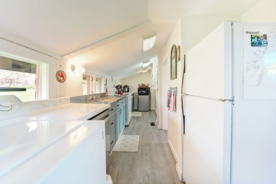 Kitchen with washer and dryer.