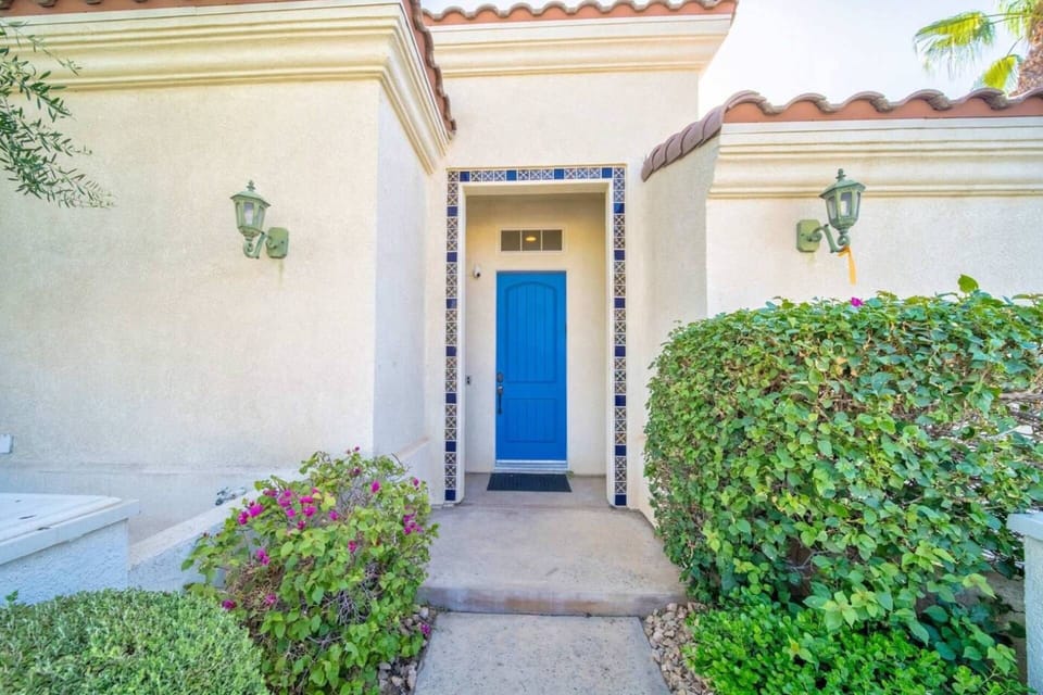 Our lovely blue front door to welcome you to our home adjacent to curated garden