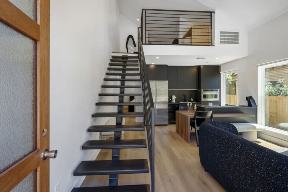 Modern Floating stairs at entrance upon arriving is an architectural wonder.
