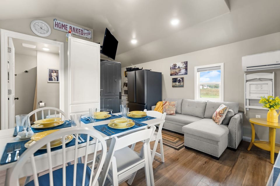 Table expands to accommodate 5  and couch expands to bigger than twin size.