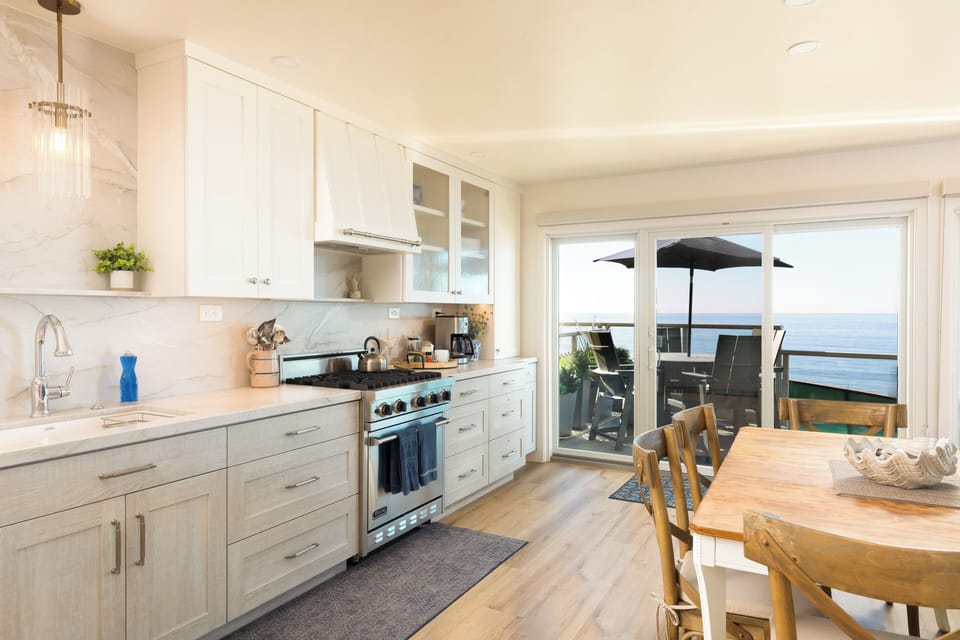 New kitchen with Quartite countertops and backsplash... full view to the beach.