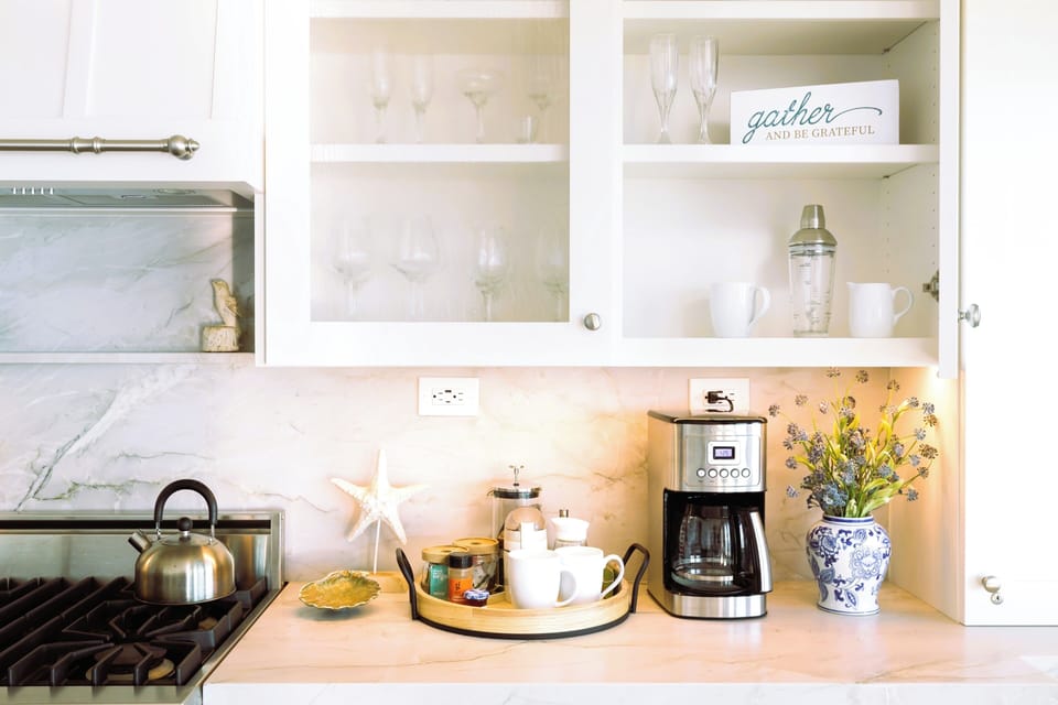 Complimentary Coffee Bar w/French Press, takeout cups/lids, asst sugars.