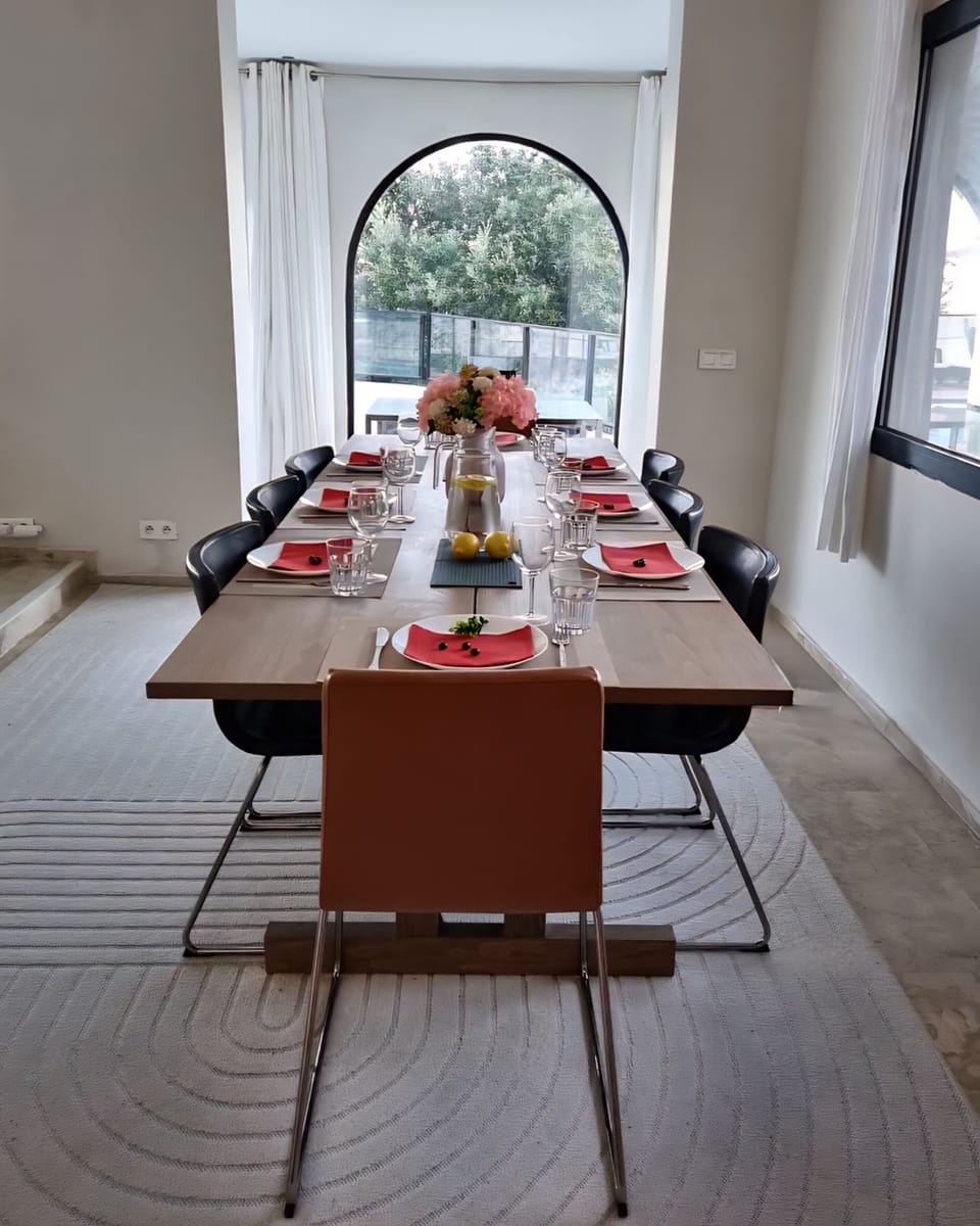 Dining table view toward the pool area, featuring sea view after trees trimmed
