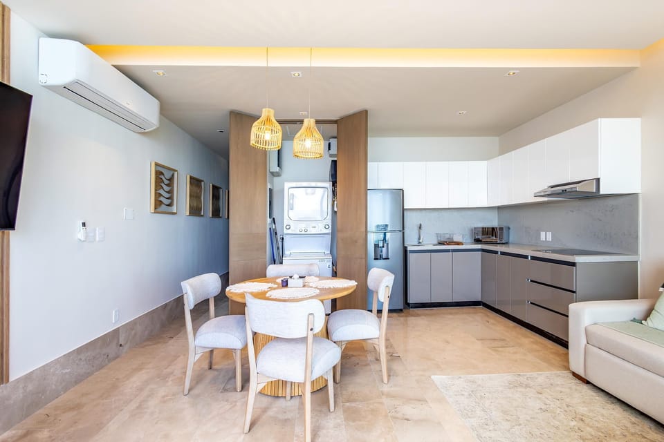Bright, modern kitchen and dining area with cozy seating