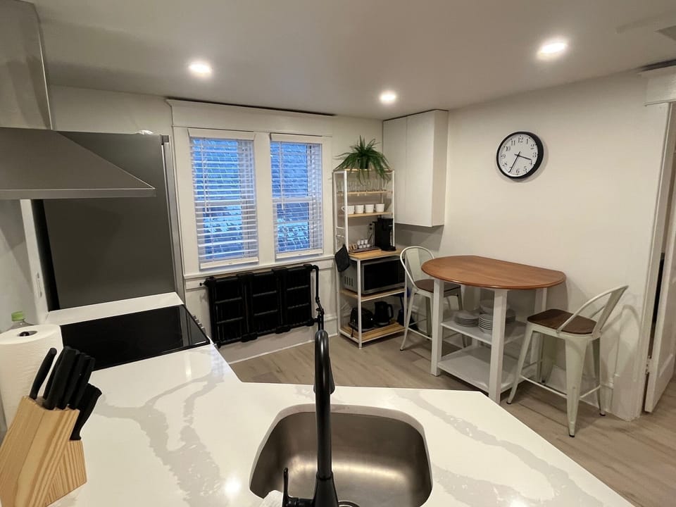 Newly renovated kitchen with quartz counters and stainless steel appliances.
