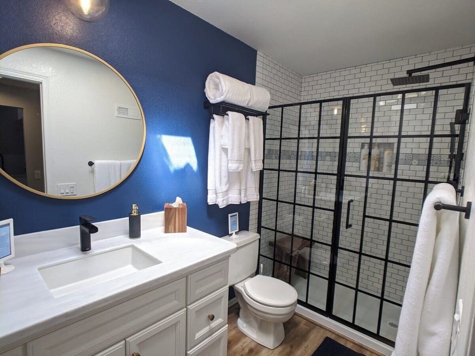Newly remodeled bathroom with tons of counter space, storage, and a luxury stand in shower with a rain shower head and a teak shower seat or step.

(Baby bath tub available if needed)
