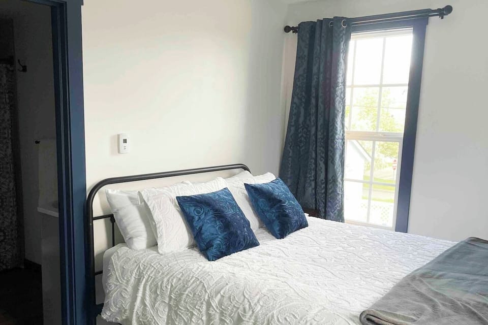 Queen bed with private bathroom.