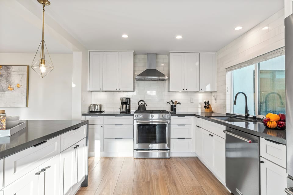Unit 1: Modern kitchen with stainless steel appliances.