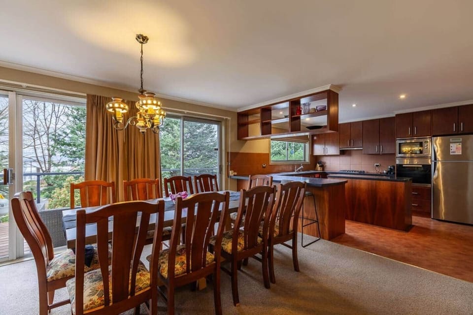 A large 12 seater dinning table and 12 chairs to entertain your whole party.