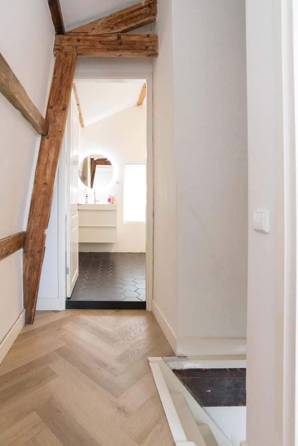 The hallway upstairs leading to the bedroom and bathroom.