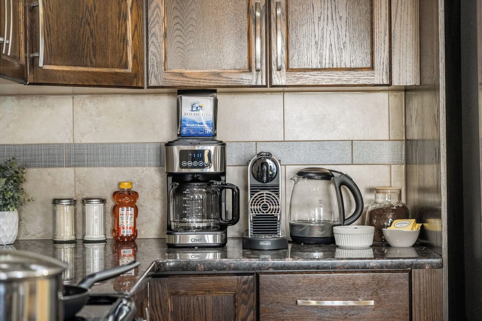 Start your day right with a full coffee station. Espresso, drip coffee, kettle, and all the fixings ready for your morning ritual.