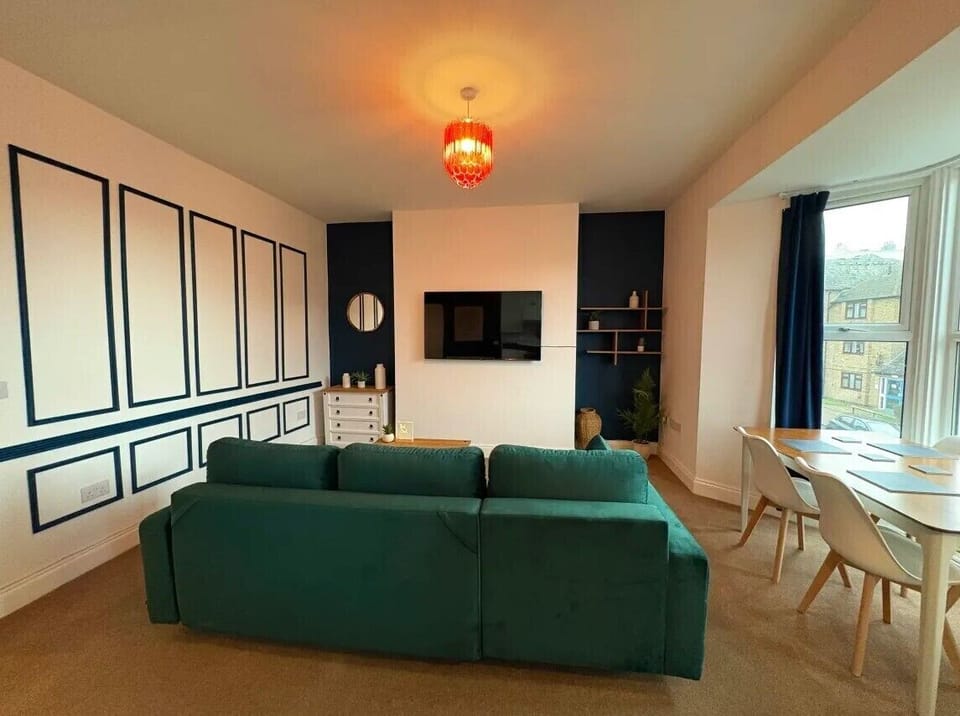 Spacious living room with 60 inch 4k TV