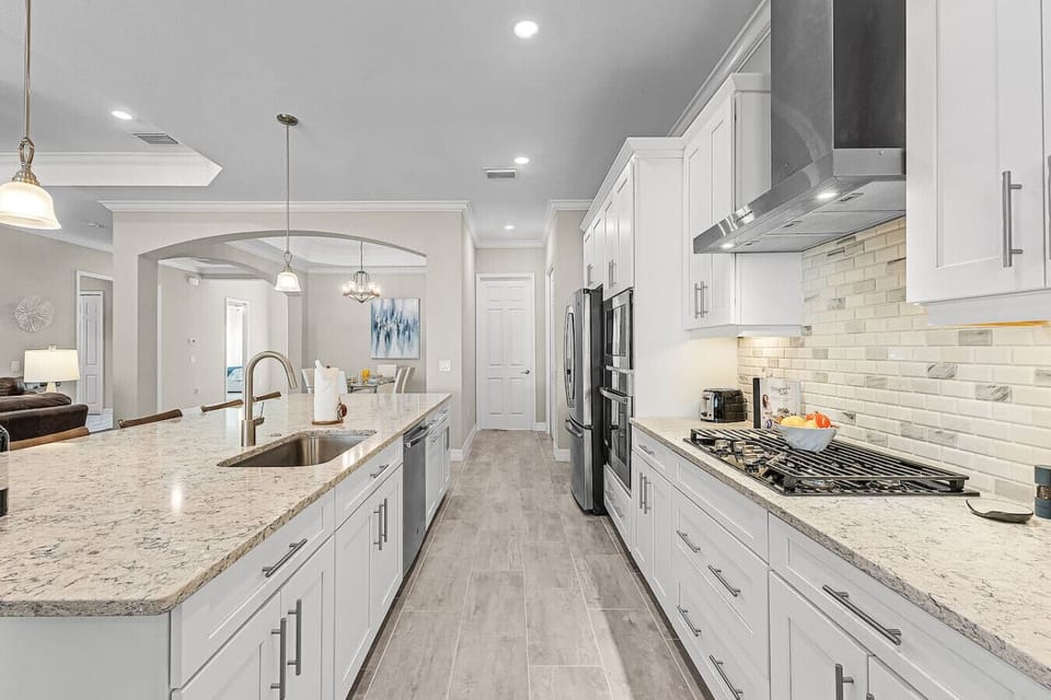 A gas range and modern appliances round out this kitchen