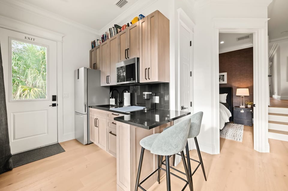 Second floor, king suite small kitchen with fridge, ice-maker, sink, toaster, Keurig  and a microwave