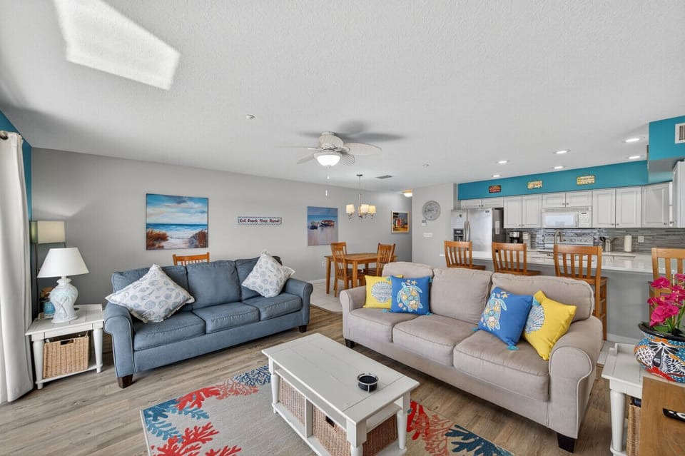 Relaxing living room w/ plush seating, coastal decor, and an easygoing beach vibe.