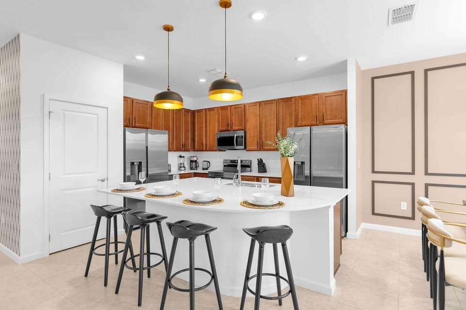 Chef's kitchen has 2 full sized fridge/freezer combo units