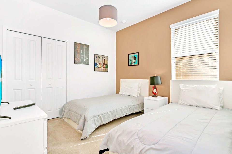 Twin Bedroom With Clean Lines And Bright Accents For Comfort