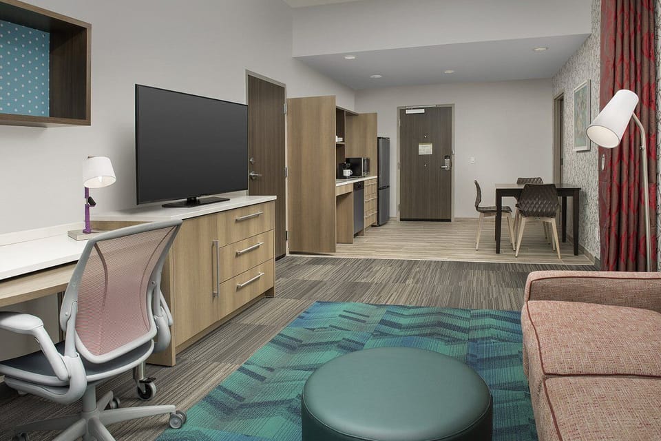 Unwind in a spacious studio with desk, TV, and lounge seating