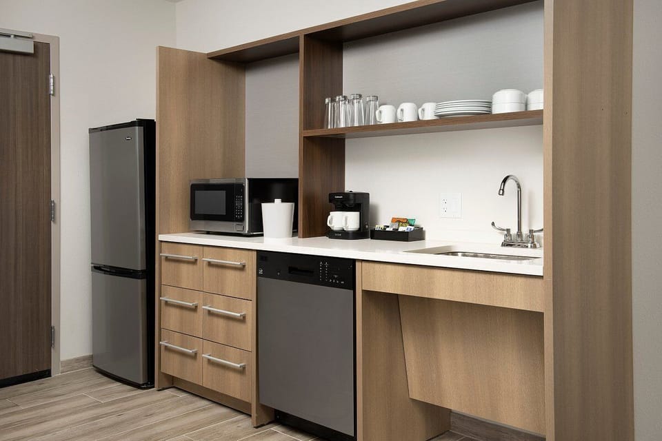 Fix quick meals easily with fridge, microwave, and sink.