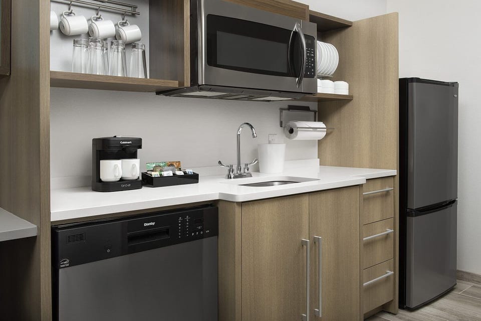 Brew morning coffee and enjoy convenient in-room kitchenette essentials.