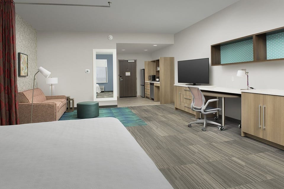 Spread out comfortably with dedicated workspace and ample storage.