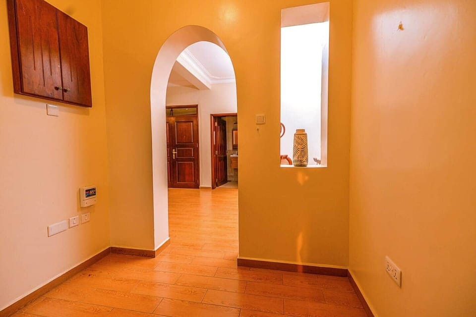 Adjoining space from the bedrooms back into the living room.