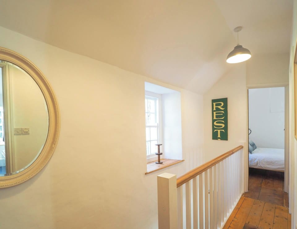Landing on to bedroom, large mirror