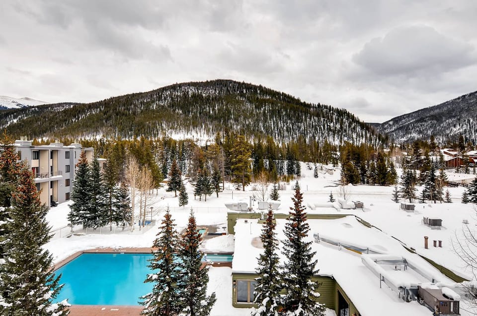 Surrounded by a tranquil winter landscape, the outdoor pool invites guests to unwind amidst the majestic peaks and fresh alpine air.