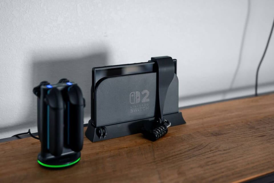 Gaming-ready setup w/ a console docked & controllers charging, perfect for downtime after a day of exploring.