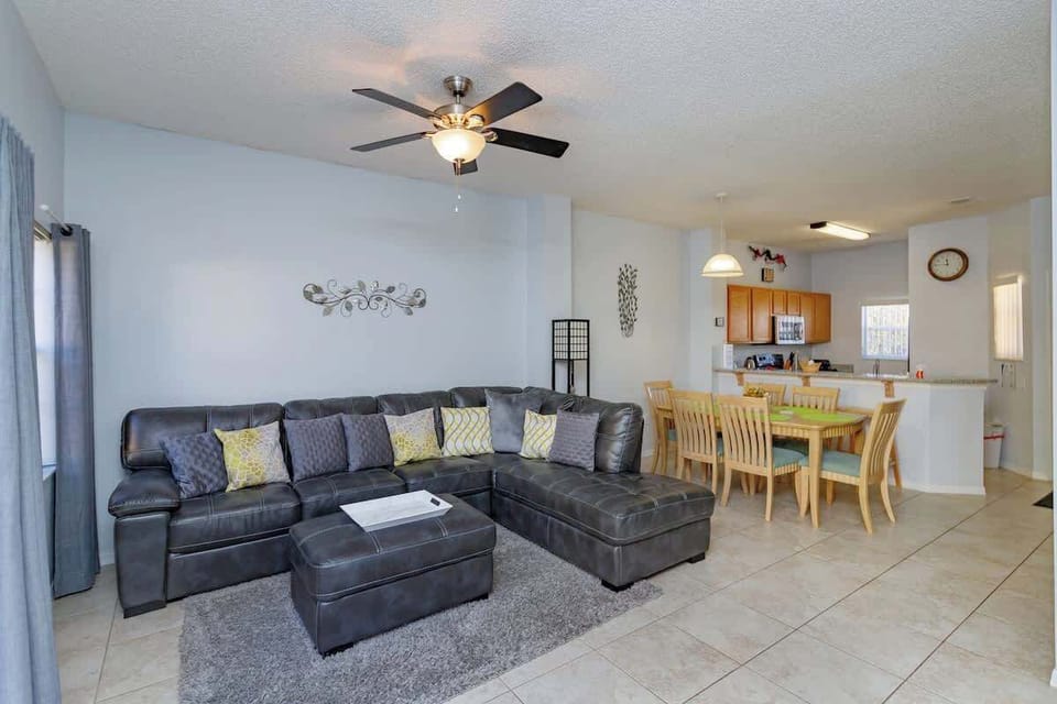 Main Floor | Relaxation Hub | TV + Outdoor Access
The perfect space to unwind after a day out—featuring a large sectional, entertainment center, and easy outdoor access