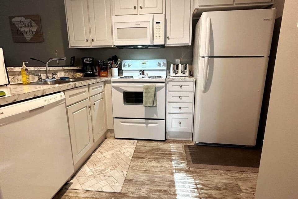 The kitchen includes Microwave, Dishwasher, and Keurig coffee maker with all the essentials.  