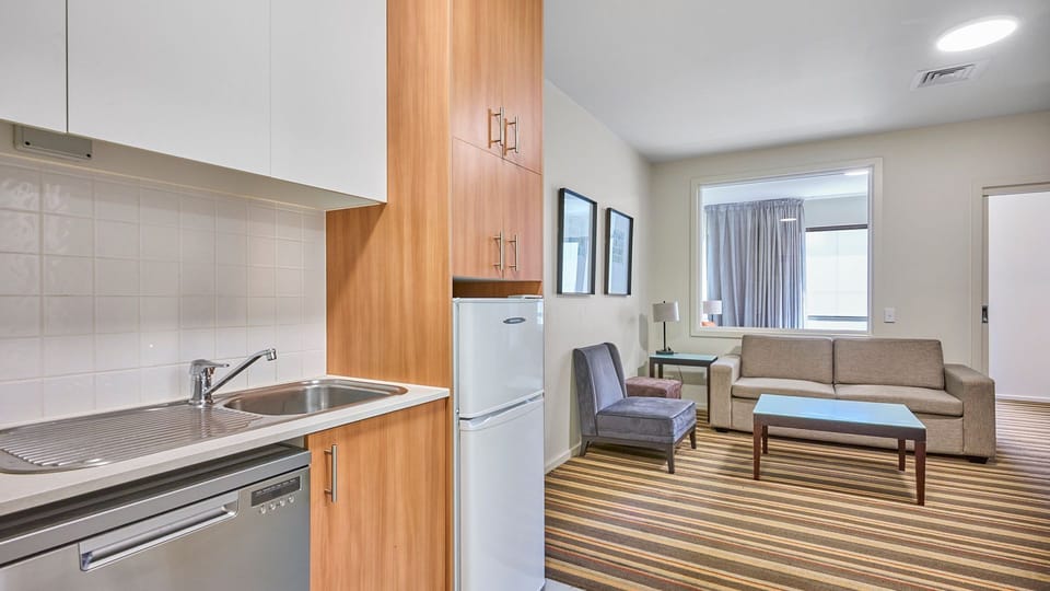 Fully equipped kitchenette with essential appliances