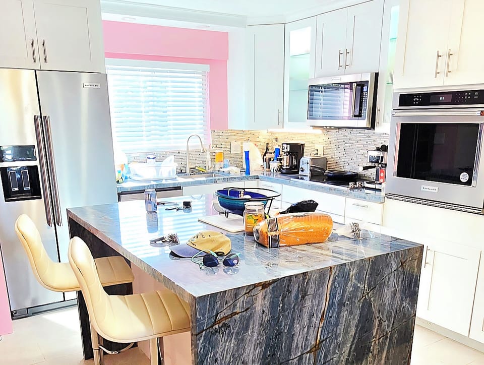 Quartzite waterfall center island. Perfect for meal prep, cooking, casual meals.